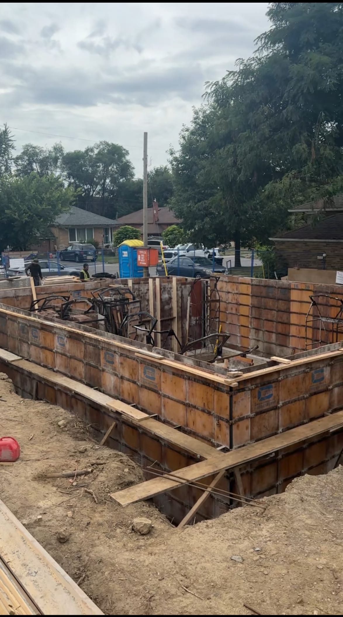 Braced multiplex foundation walls in Scarborough prepared for concrete pour with installed formwork