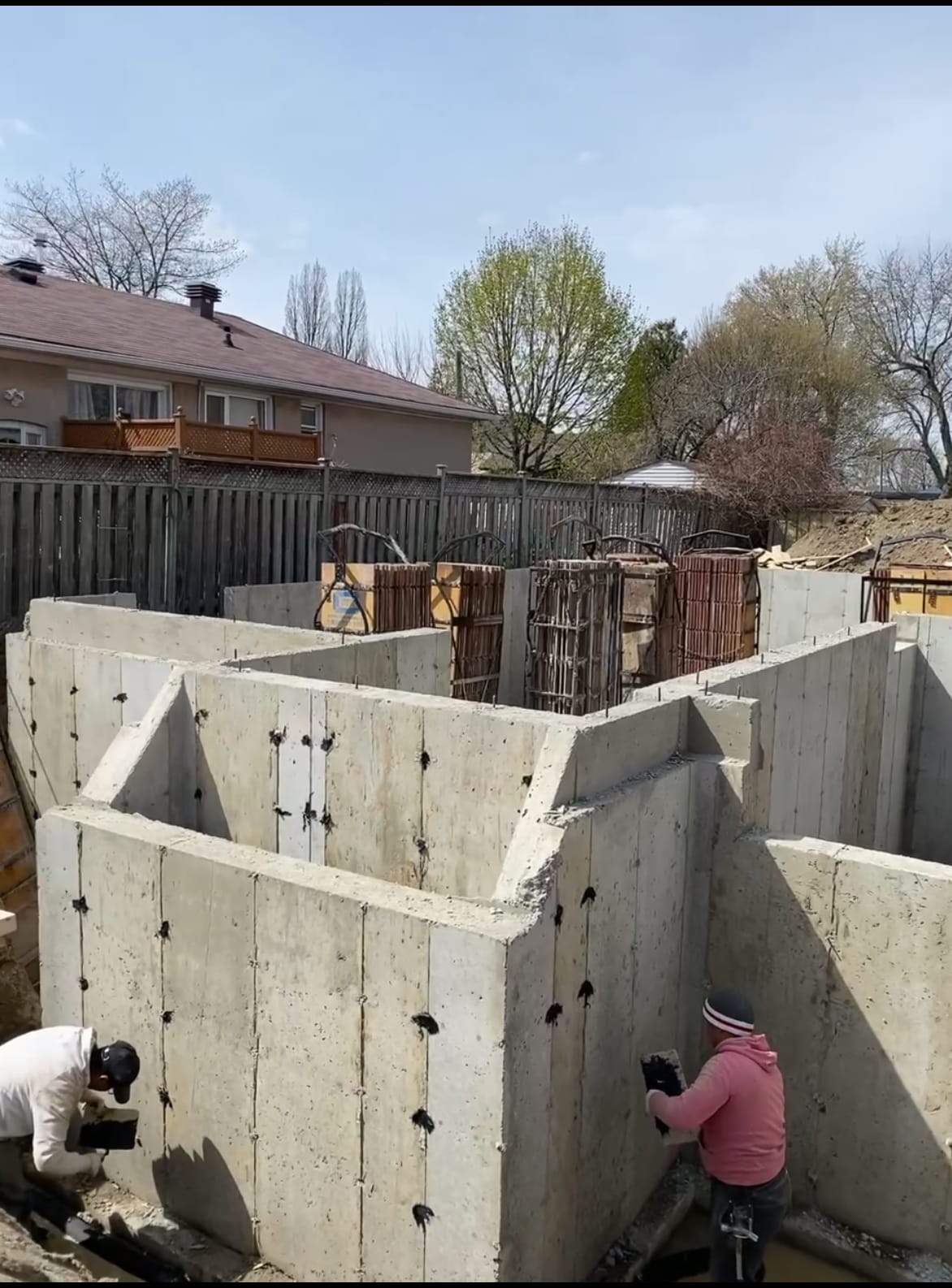 Laser level measurement for precise wall formwork assembly at Scarborough foundation construction