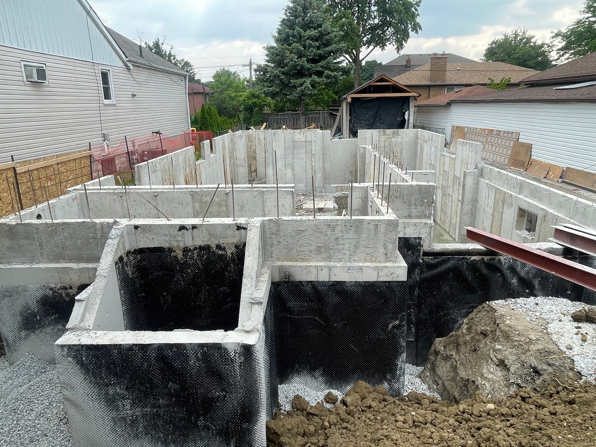Backfilled residential foundation walls completed for custom home in Scarborough Toronto