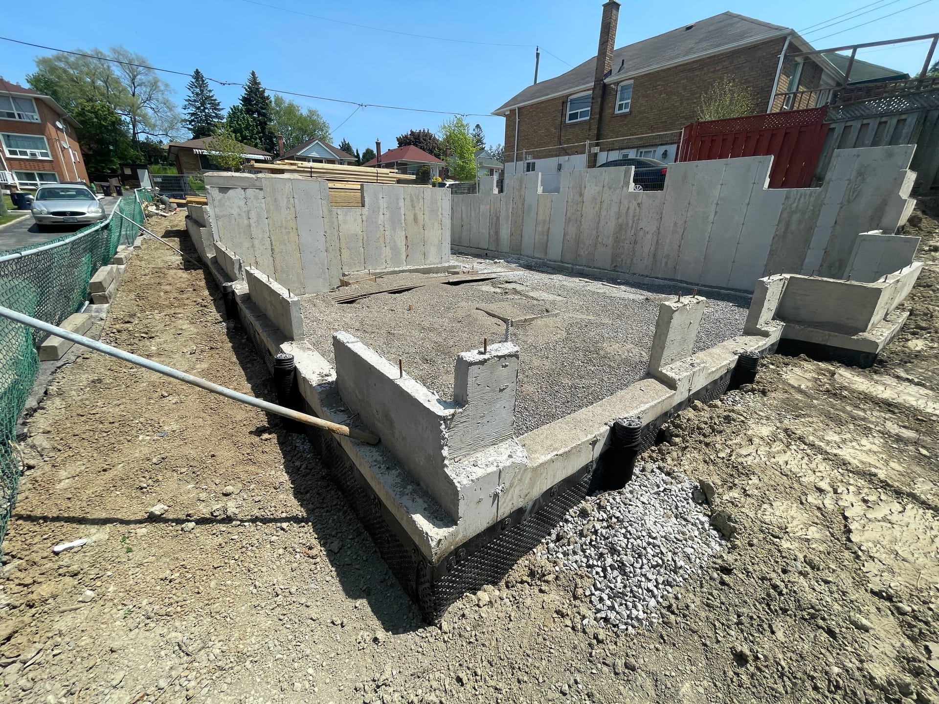 Concrete foundation walls cured and backfilled for North Woodrow residence in Scarborough