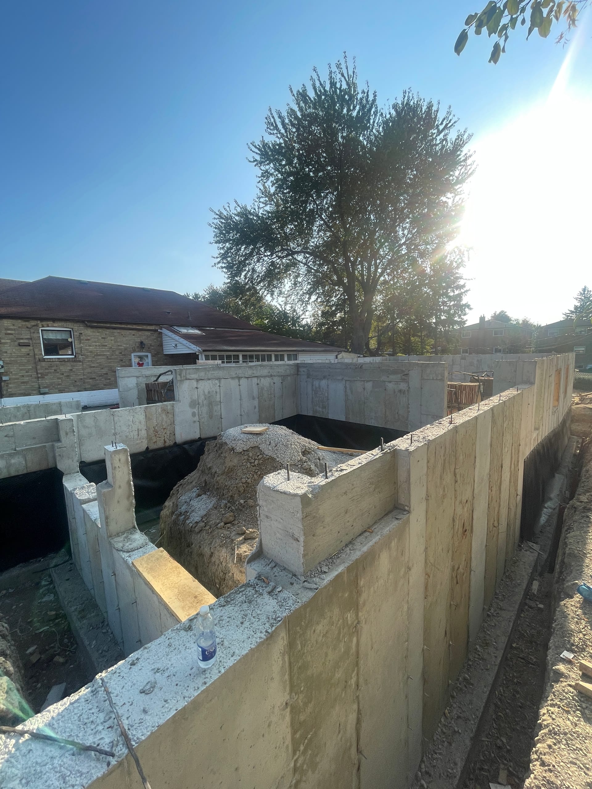 Finished concrete foundation walls standing complete for new home construction Scarborough Toronto