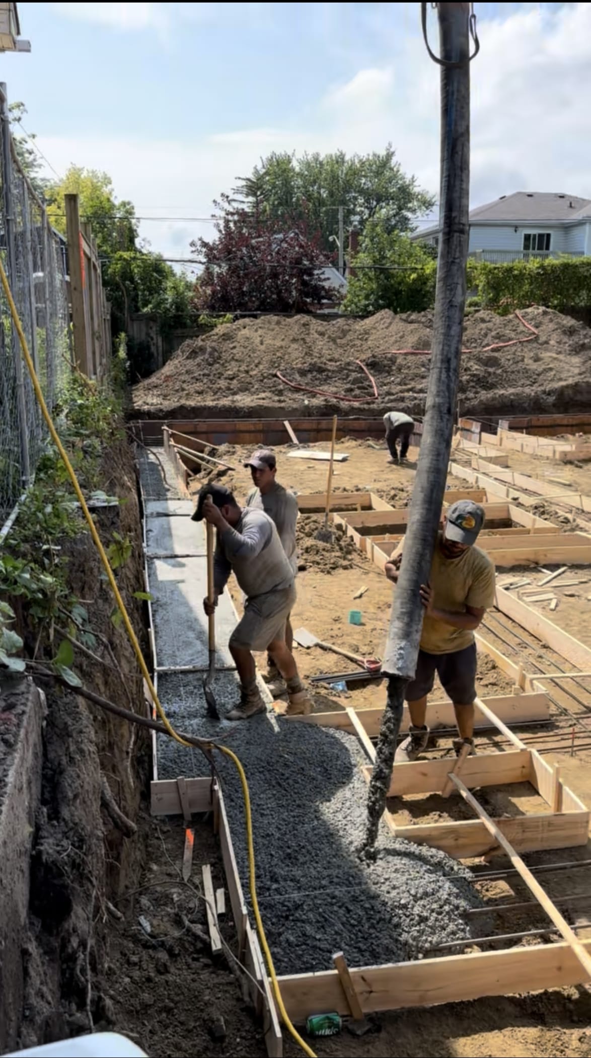 Stripped foundation walls with rebar cages ready at Scarborough project site