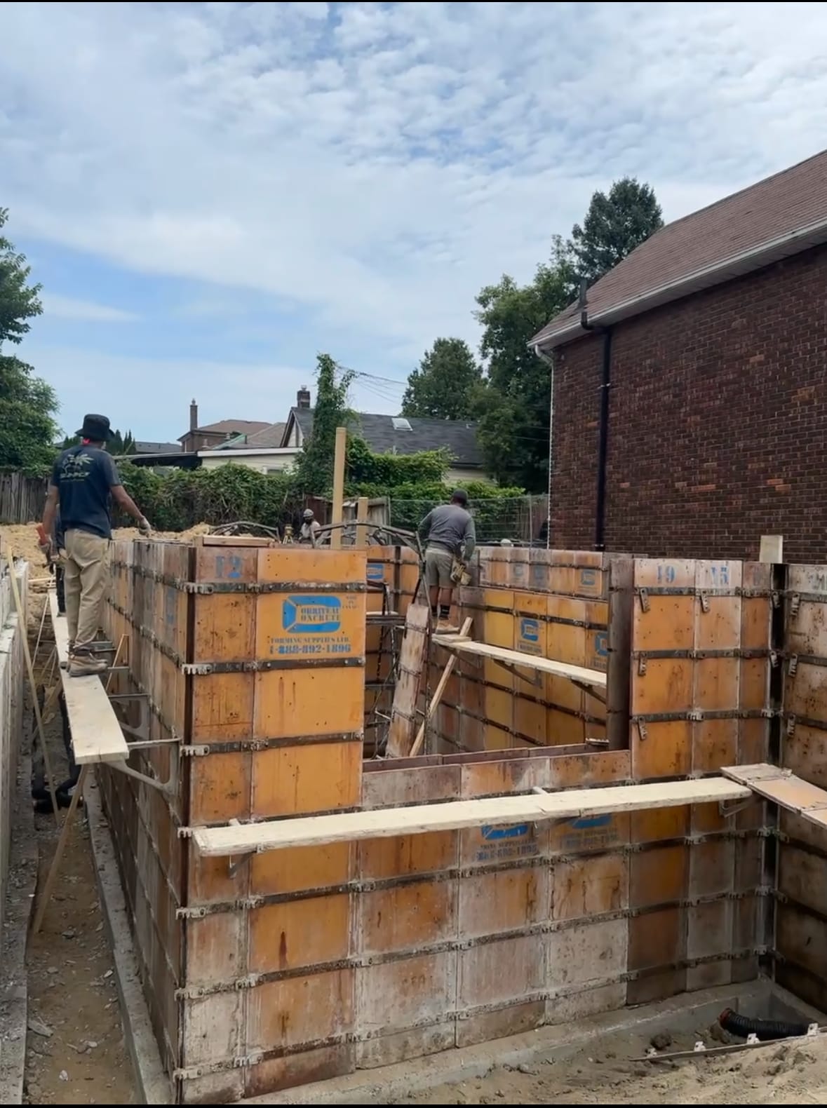 Braced foundation wall formwork prepared for concrete pour in Scarborough