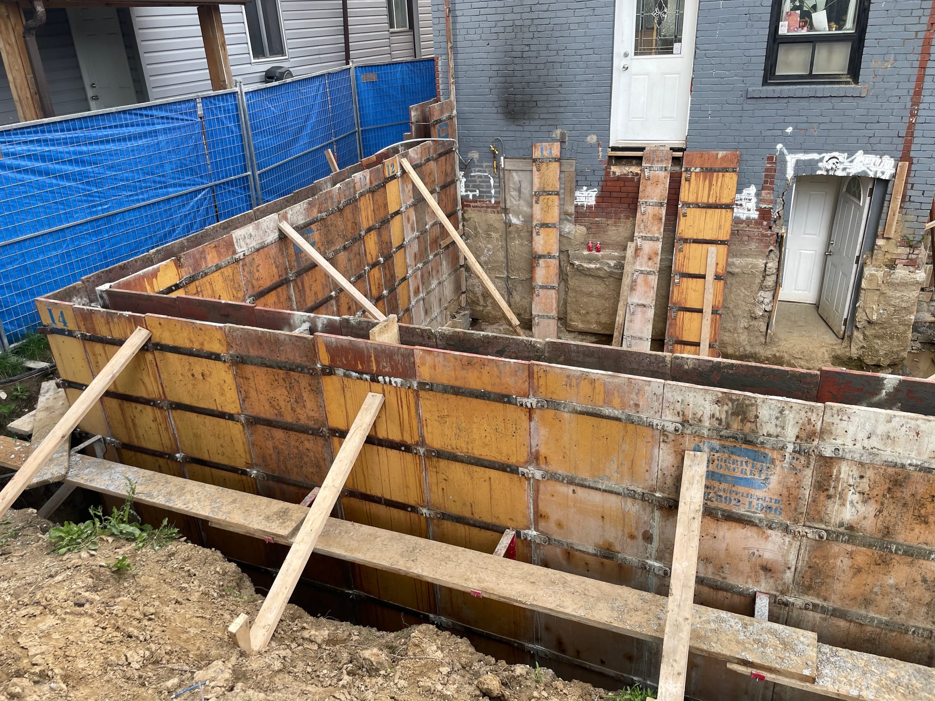 Secured foundation formwork awaiting concrete pour at Scarborough residential extension site