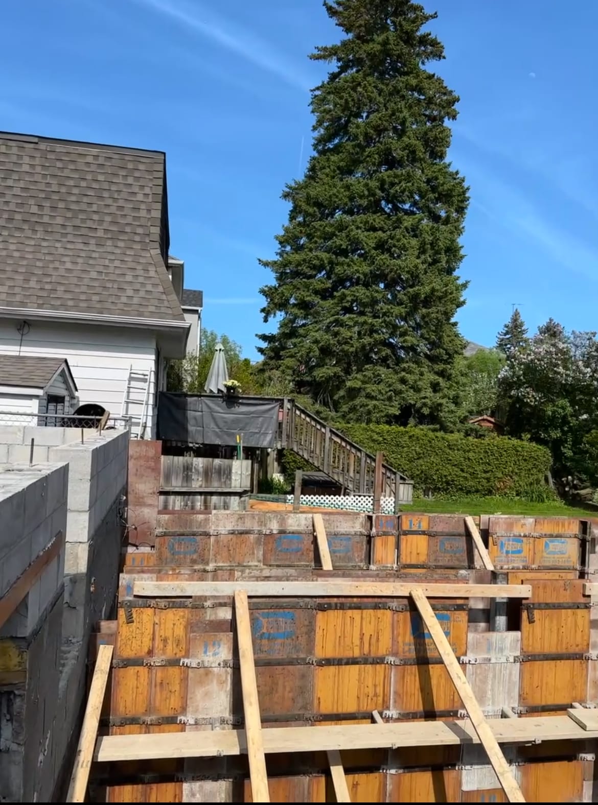 Concrete formwork positioned adjacent to existing home structure in Scarborough Toronto