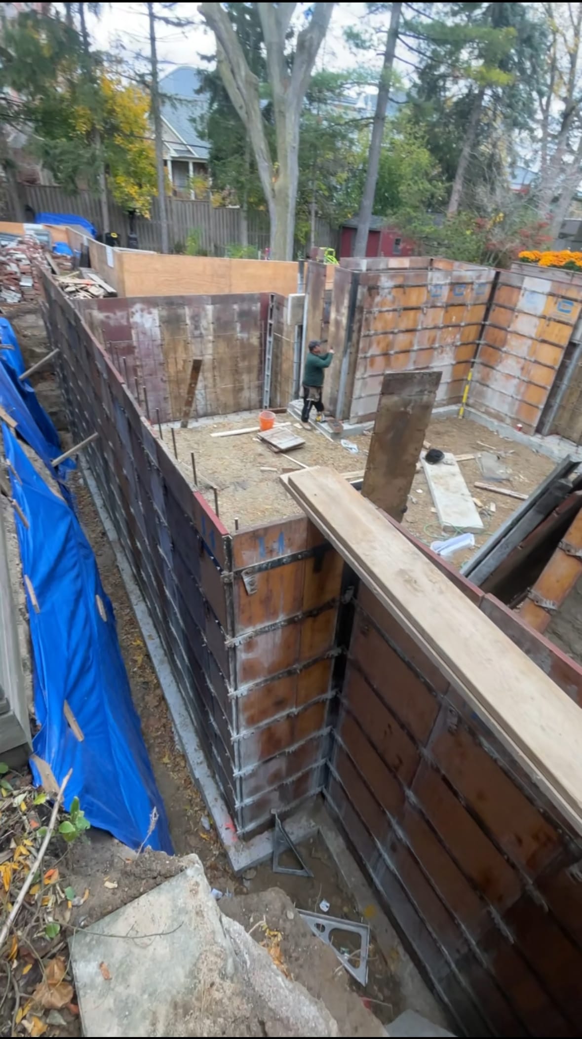 Concrete wall forms being assembled for Toronto foundation extension project