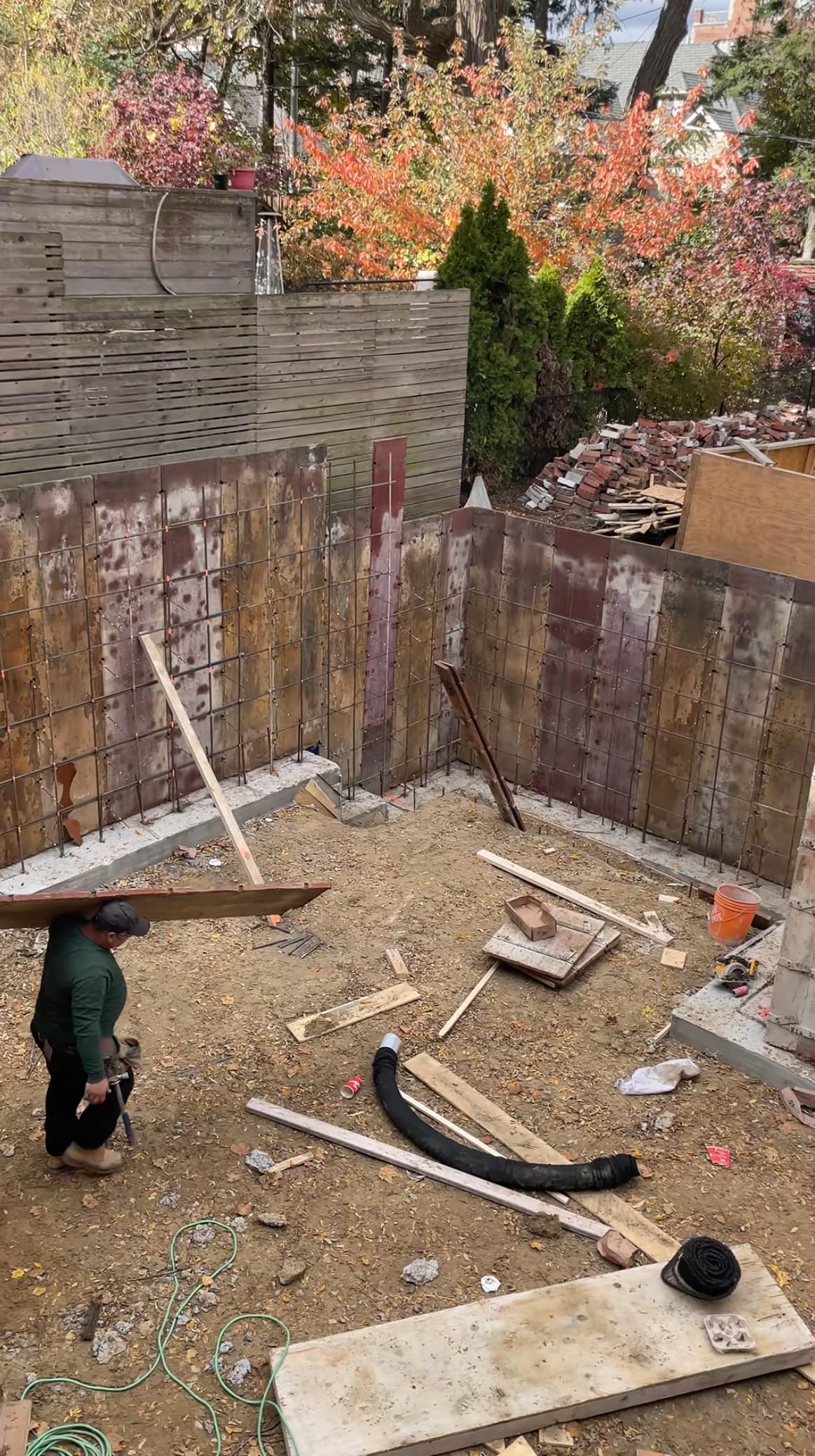 Fresh concrete being poured into footing forms for Toronto residential foundation extension