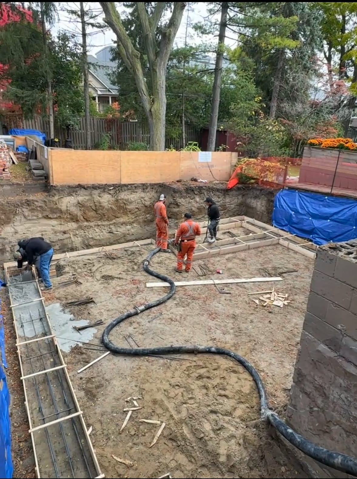 Finished foundation extension walls with smooth concrete surfaces in Toronto residential project
