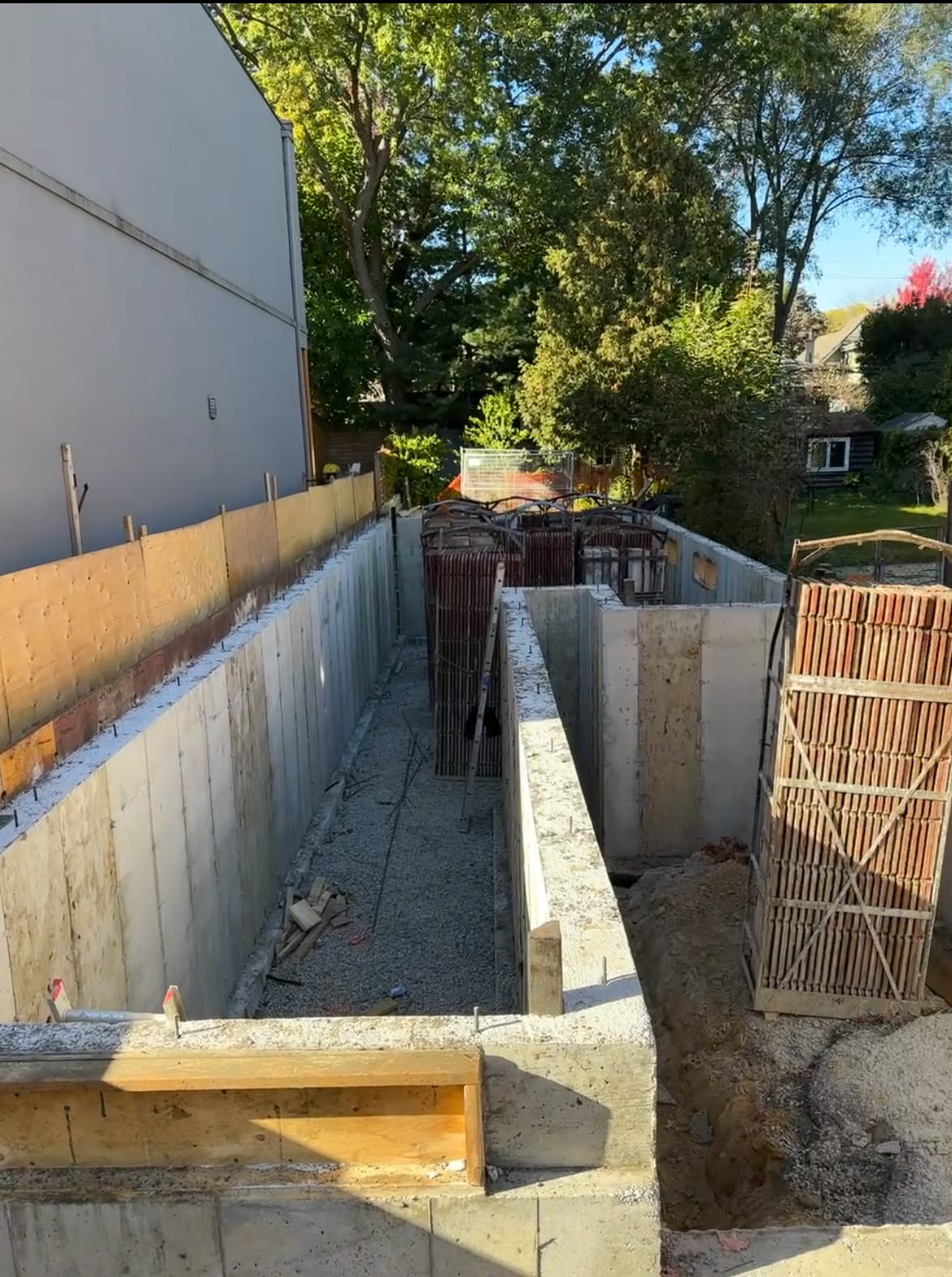 Toronto foundation walls after form stripping awaiting waterproofing membrane application