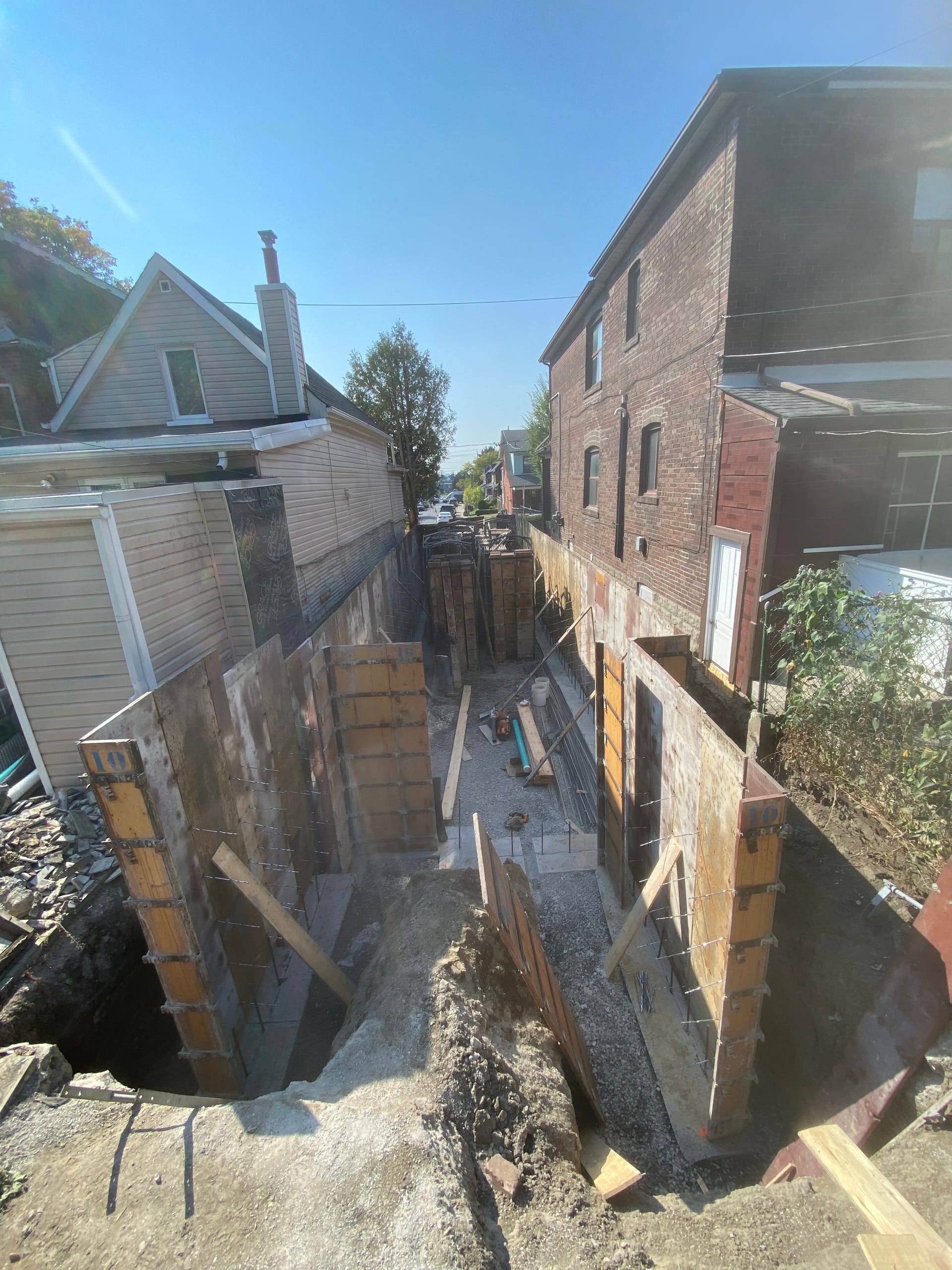 Foundation wall formwork assembly on tight urban lot for residential construction in Toronto