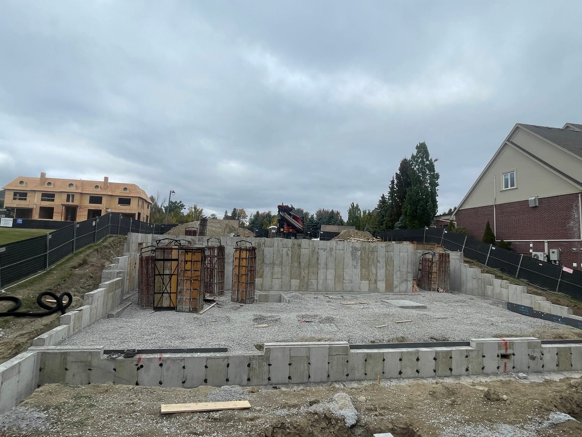 Completed foundation walls in Vaughan with rebar cages being loaded for next construction phase