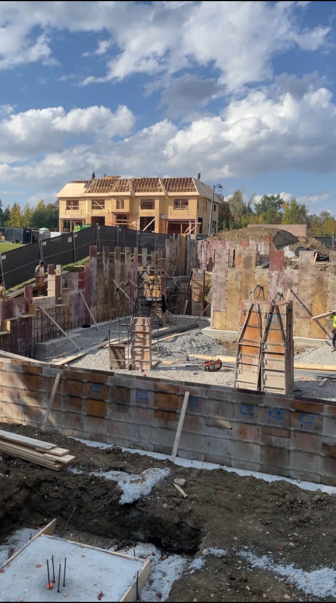 Foundation waterproofing in Vaughan showing wax cement application and weeping tile installation underway