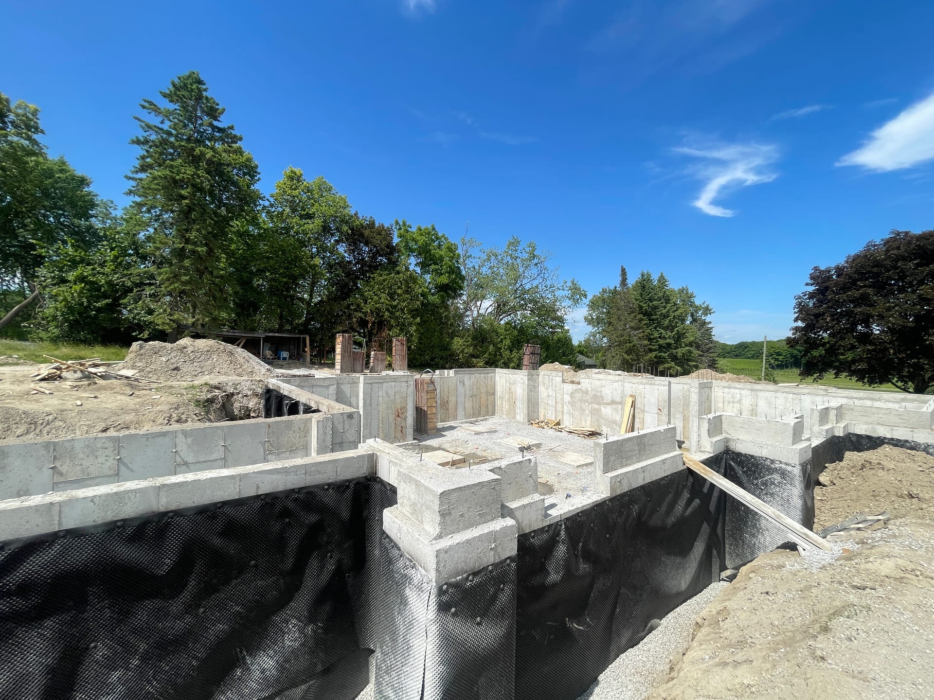 Footing formwork with fresh concrete pour for residential foundation in Whitby Ontario