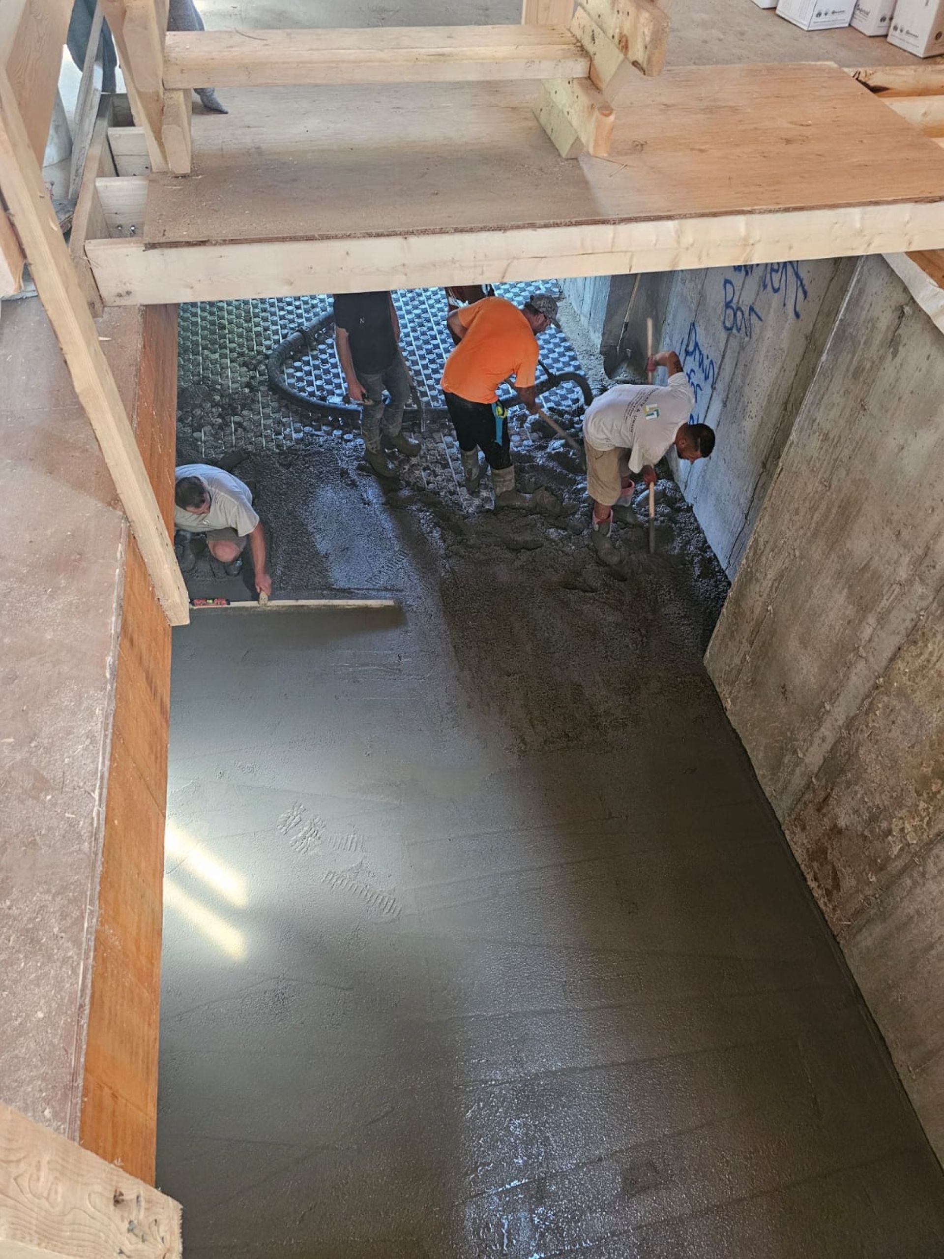 Fresh concrete slab pour with smooth finish