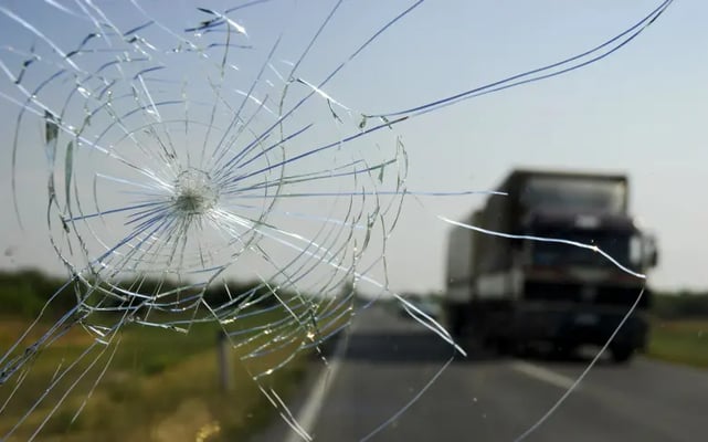 Drivers view of a damaged car windscreen after a car crash