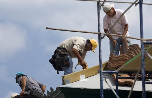 Men working at height on dangerous scaffolding