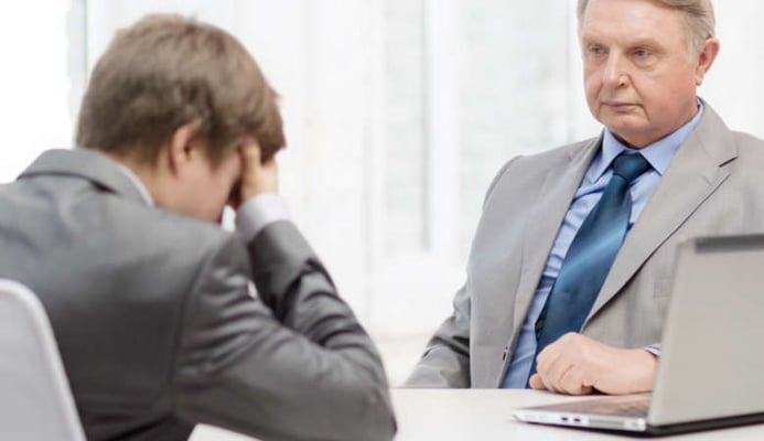 Man with his employer facing dismissal