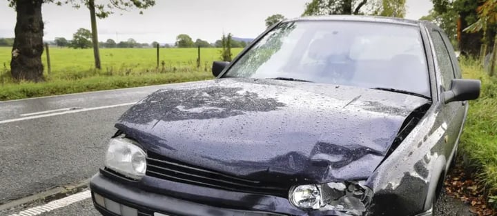 Abandoned car with front end damage