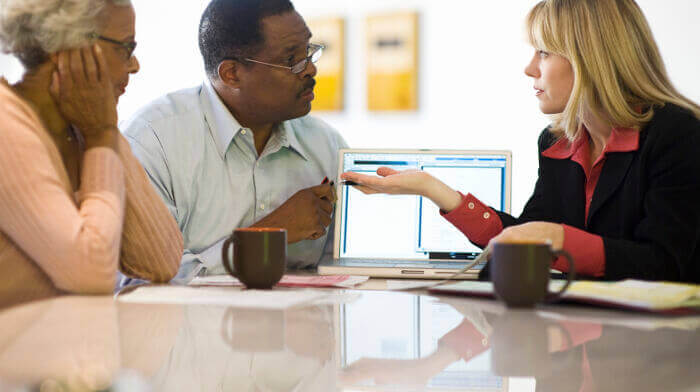 Couple talking to solicitor