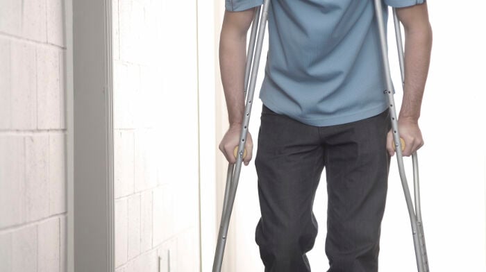 Injured man on crutches