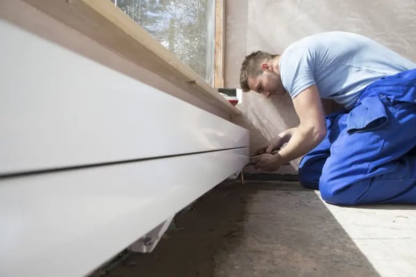 Man at work fitting a kitchen