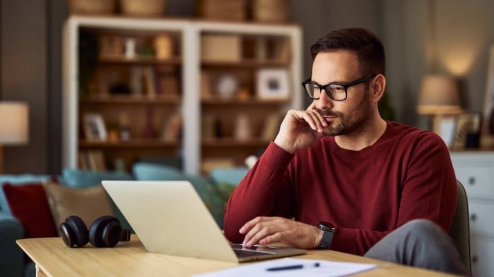 Concerned homeworker sitting at his desk