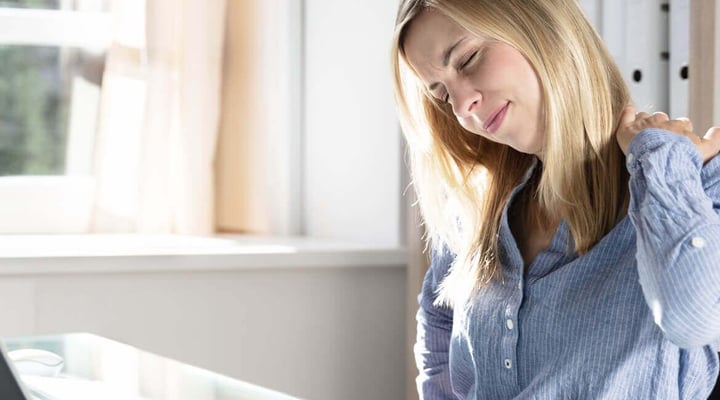 Woman with whiplash neck injury