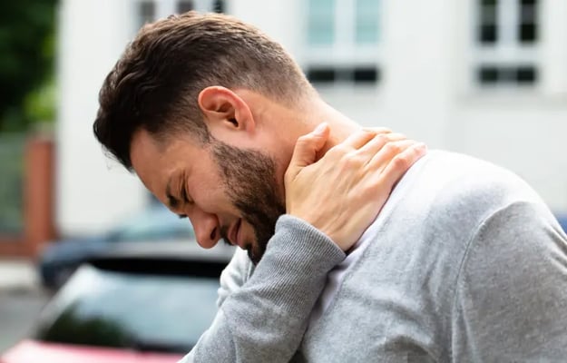 Man with low value soft tissue injury to the neck