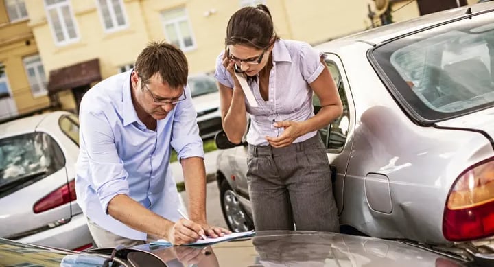 Drivers exchanging details after a road accident