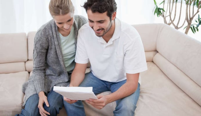 Couple reading news that they have won their injury claim