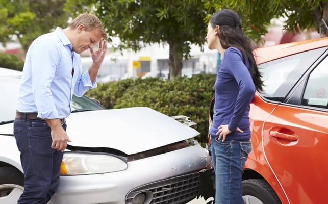 Two drivers in a confrontation after a car accident