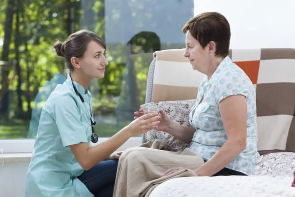 Injured woman with nurse wondering if she can get legal aid for a claim