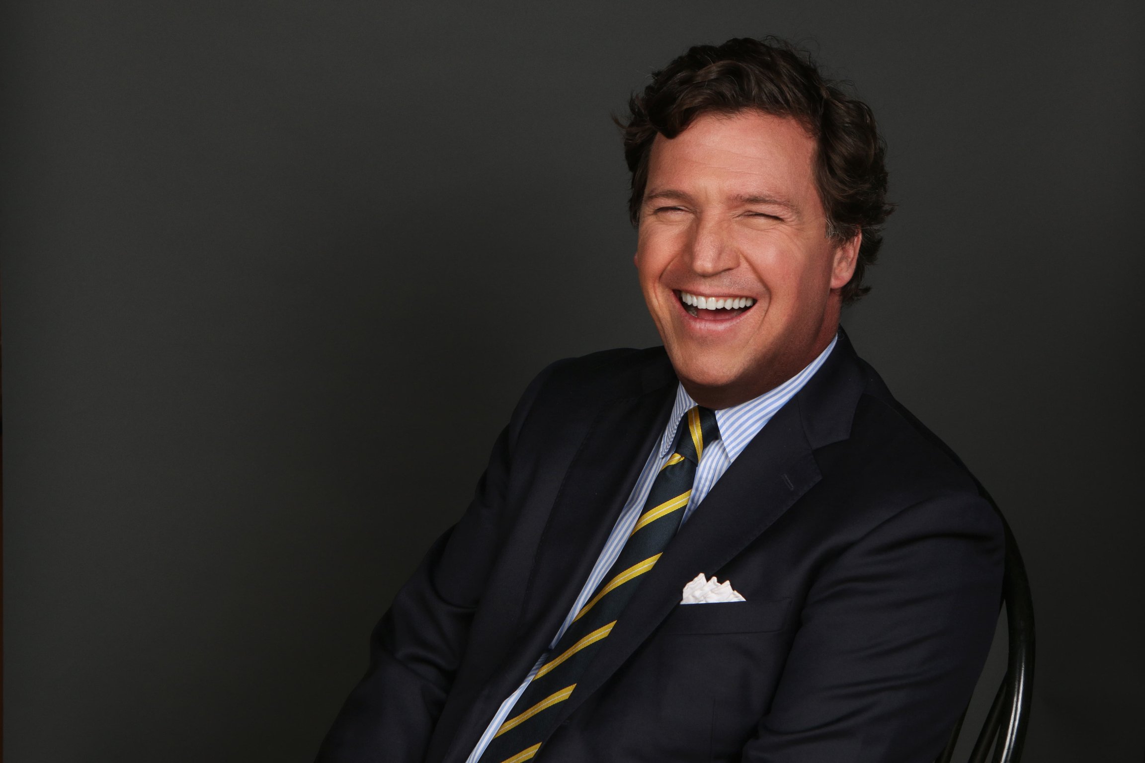 A photo of Tucker Carlson smiling
