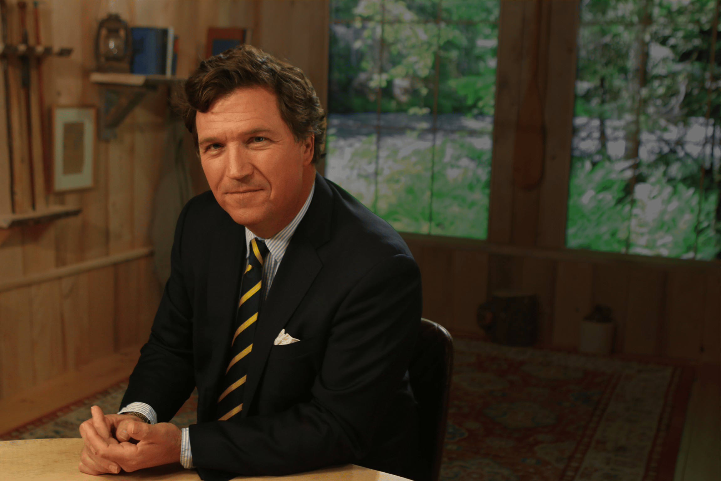 A photo of Tucker Carlson smiling