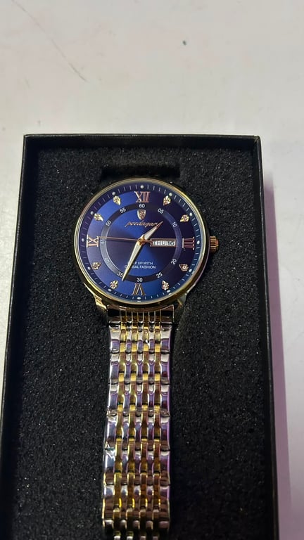 Poedagar luxury analog watch for men featuring a blue dial and a two tone stainless steel strap