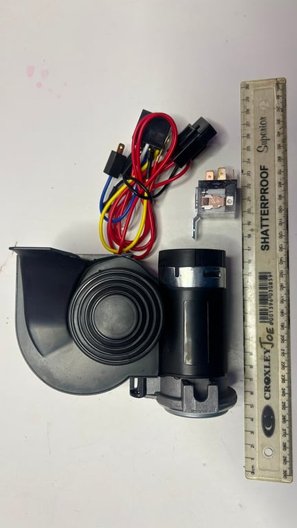 12-volt black comapct electric horn kit designed for trucks cars and motorcycles Brand new but damaged on one side
