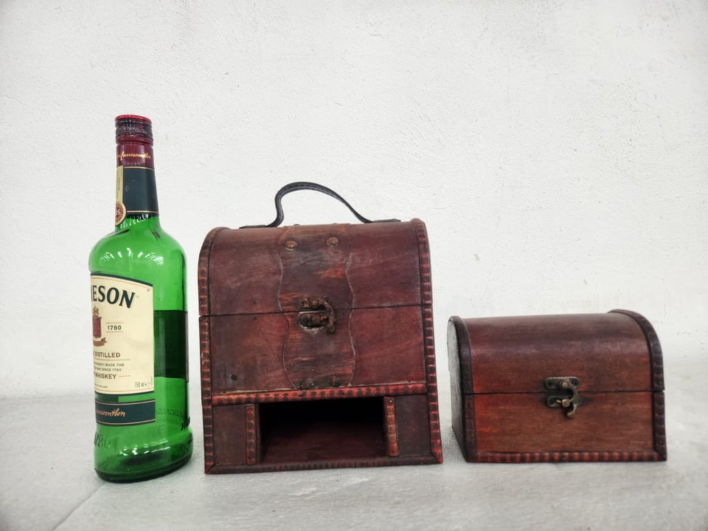 Set of two wooden domed-top storage chests 20th century style