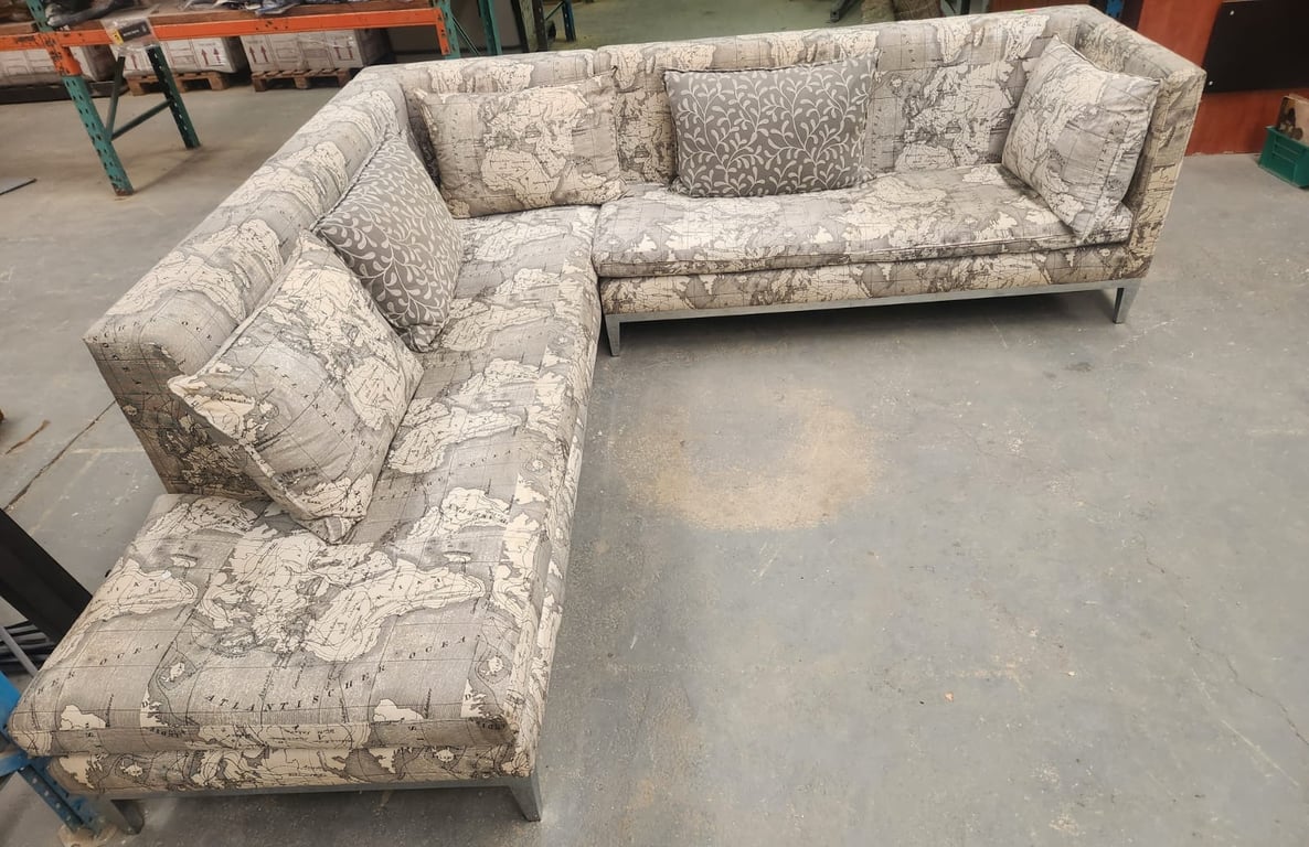 Large Corner Couch with a world map pattern and metal legs