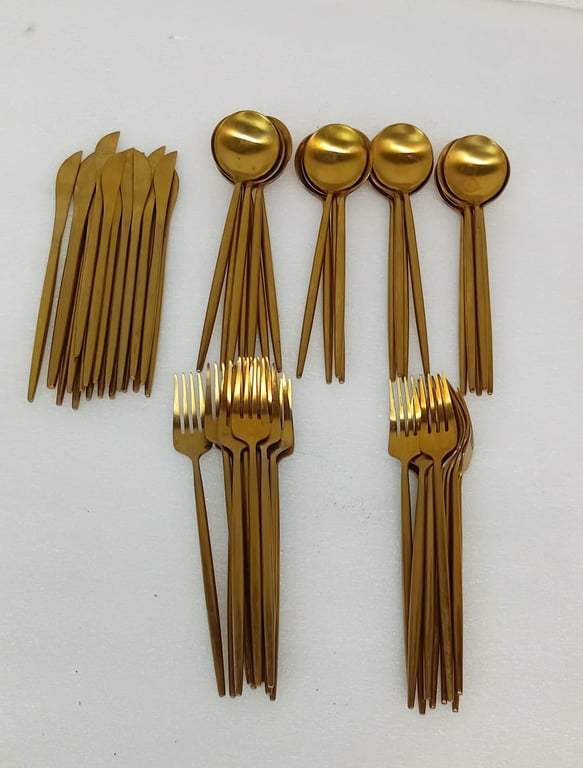 A Set Of Gold-Colored Cutlery
