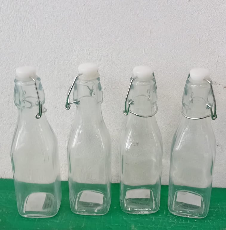 4 x Glass swing top bottles
