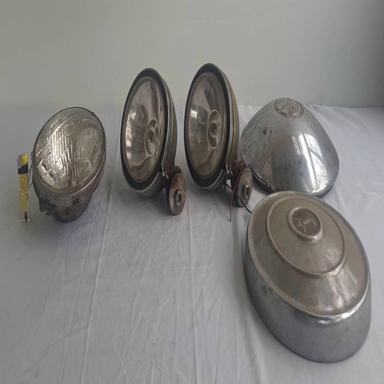 Collection of Vintage Automotive Headlights and Light Housings