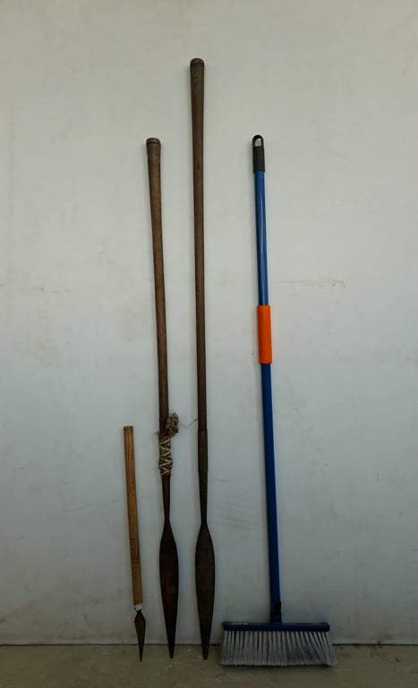 Collection of Decorative Wooden Spears and Staff