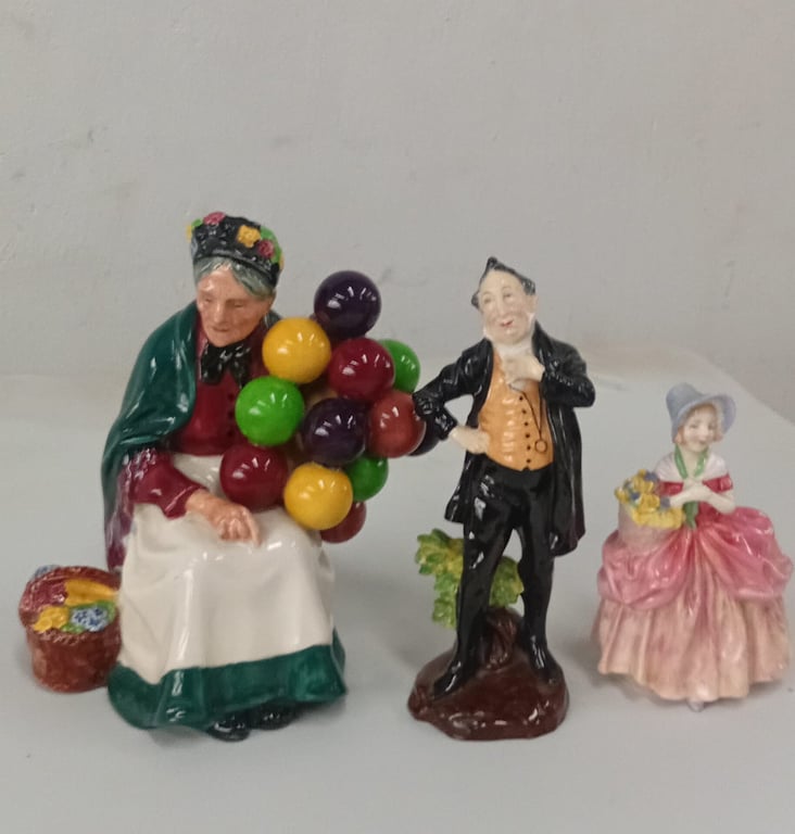 Three porcelain or ceramic figurines