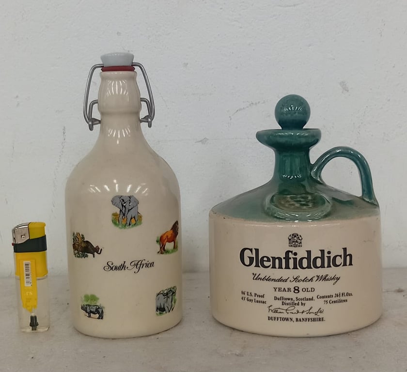 Ceramic stoneware bottles decorated with the Glenfiddich stag crest