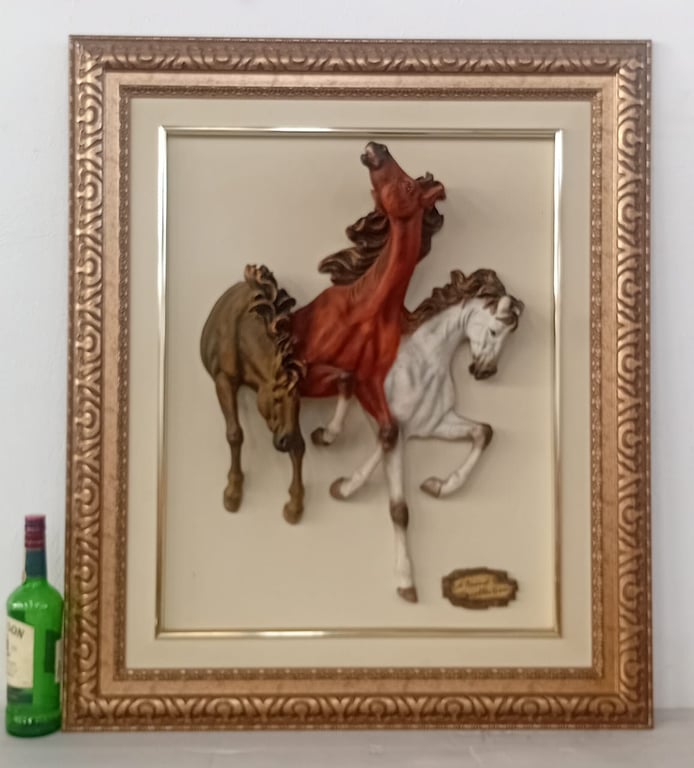 3D framed sculpture of three galloping horses