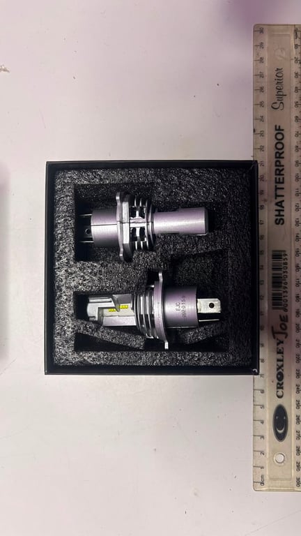 H4 LED headlight bulbs featuring a silver housing and integrated cooling fans brand new