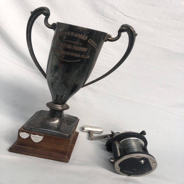 Fishing Reel and Trophy