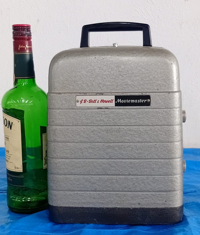 Vintage S.B. Bell & Howell “Moviemaster” Film Projector – Classic Metal Carry Case Design