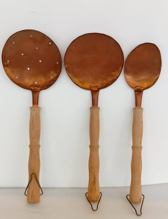 A set of  antique copper kitchen utensils
