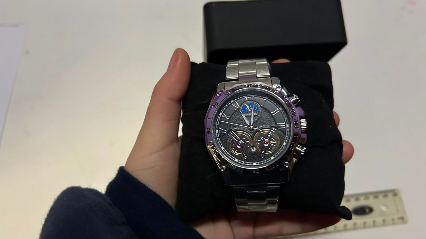 BINBOND stainless steel quartz features a dark textured dial and black toned bezel